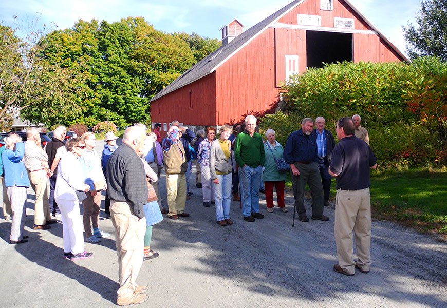 Curator Michael O'Conner giving a tour to visitors at Enfield Shaker Museum in Enfield, New Hampshire.