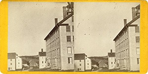 Stereoview of Enfield, NH Shaker Village - Looking east down the lane between the Wood House (left) and the Great Stone Dwelling (right).