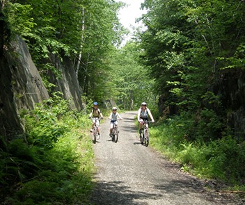 Biking on the Rail Trail through the "Big Cut" in Enfield New Hampshire