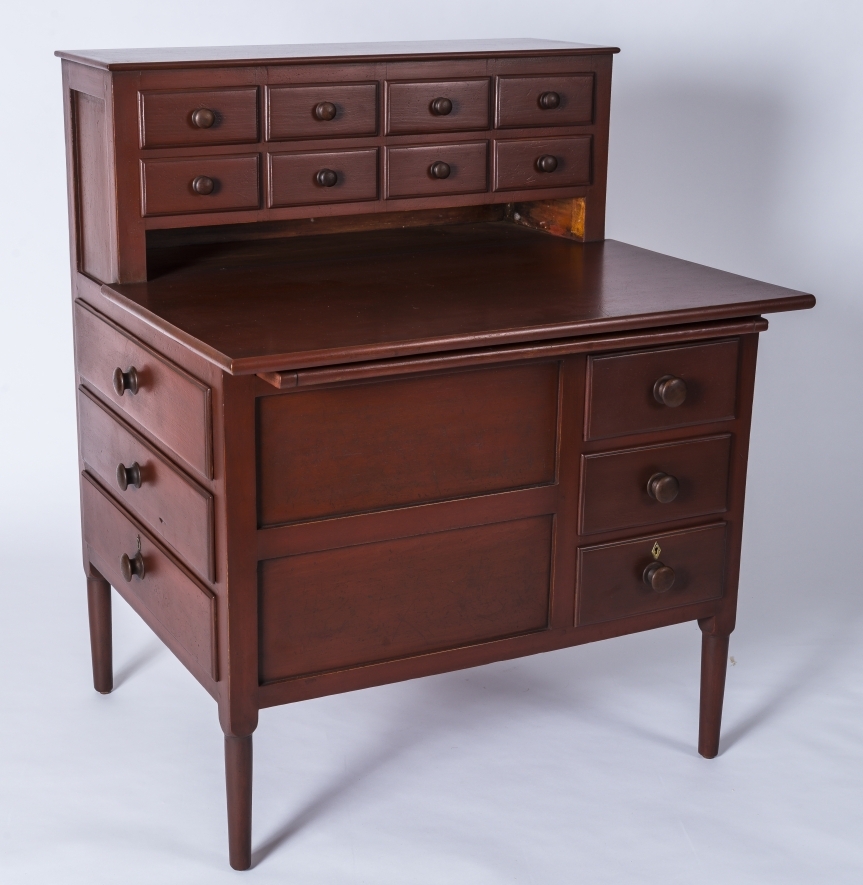 Photo of red work desk (2021.12.1) with upper gallery of 8 drawers.