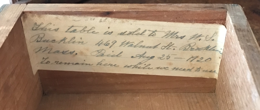 Photo of label glued inside one of the gallery drawers of small work stand (2021.19.1).