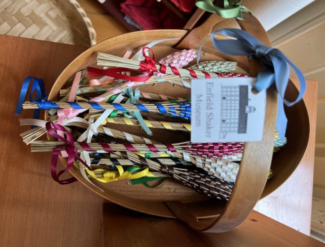 Lavender wands in a Shaker oval carrier.