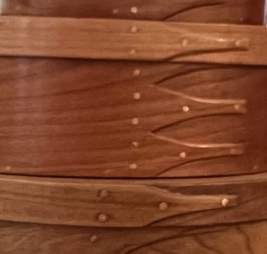 Swallow tail joints on oval boxes.