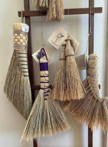 A variety of whisk brooms